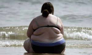 obese woman on beach