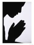 sillouette of praying woman
