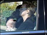 Singer Brittany Spears drives with infant son on her lap.