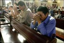 fathers praying in church