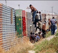 Illegals jumping border fence